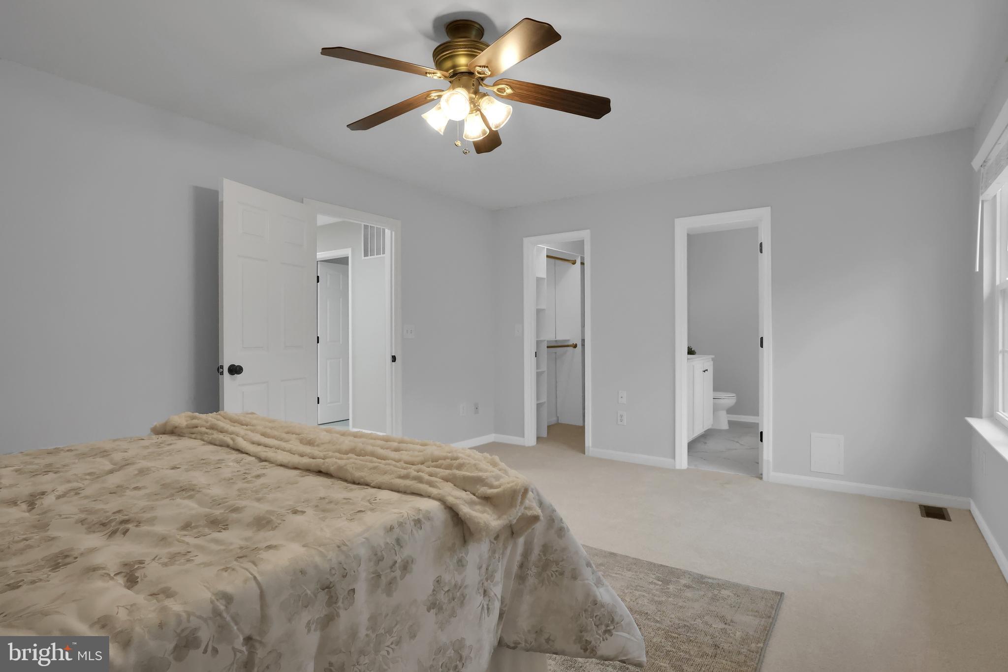 126 Myrtle Avenue Severn, MD 21144 - Photo 22 of 52 a bedroom with a bed and a chandelier