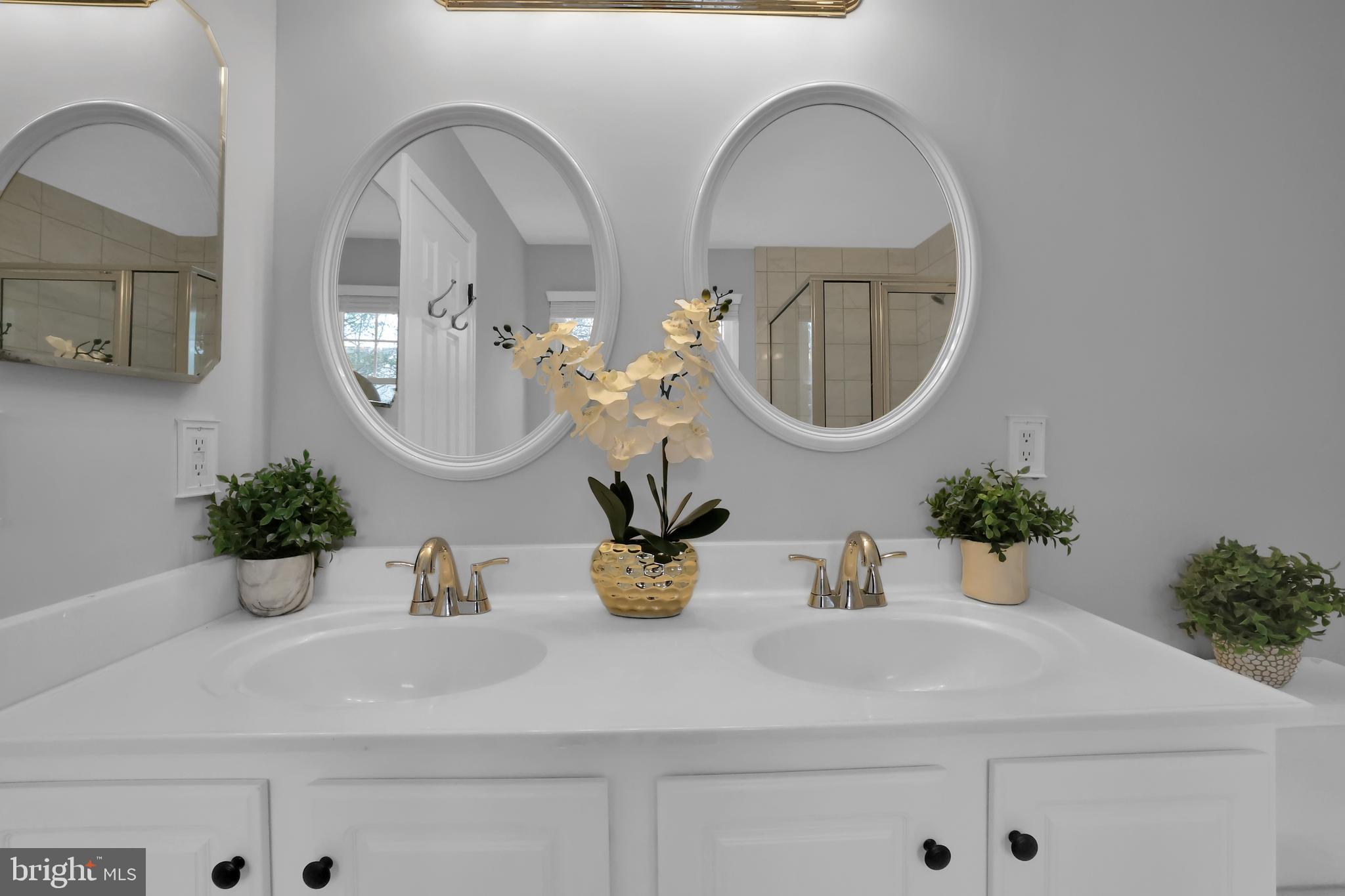 126 Myrtle Avenue Severn, MD 21144 - Photo 26 of 52 a bathroom with a sink mirror and vanity