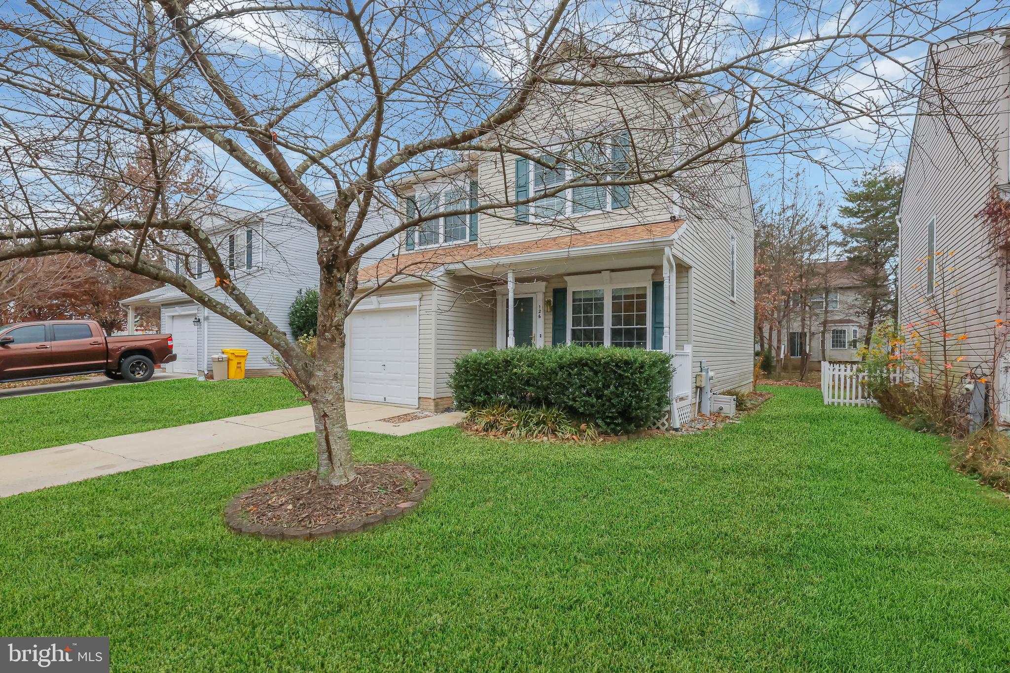 126 Myrtle Avenue Severn, MD 21144 - Photo 3 of 52 a front view of a house with a garden and tree