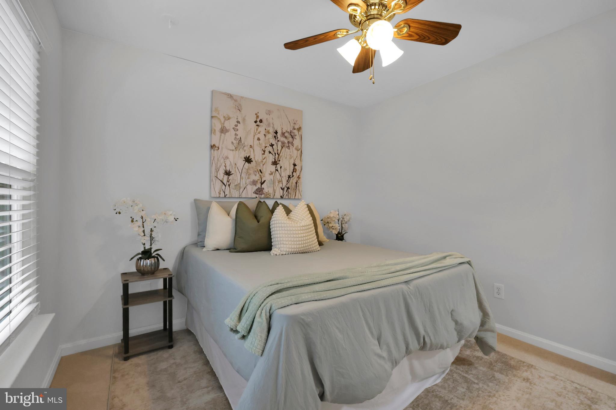 126 Myrtle Avenue Severn, MD 21144 - Photo 31 of 52 a bedroom with a bed and a chandelier