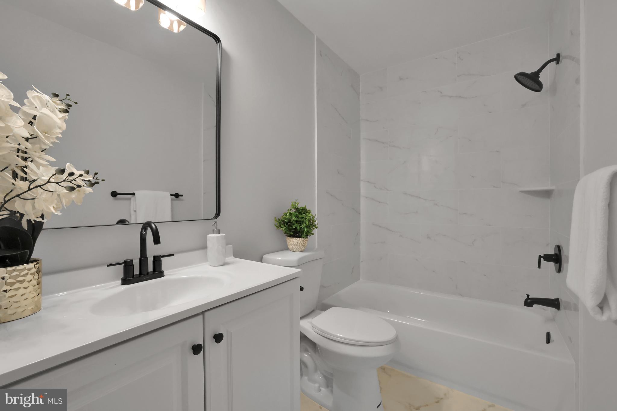 126 Myrtle Avenue Severn, MD 21144 - Photo 32 of 52 a bathroom with a sink a toilet and shower