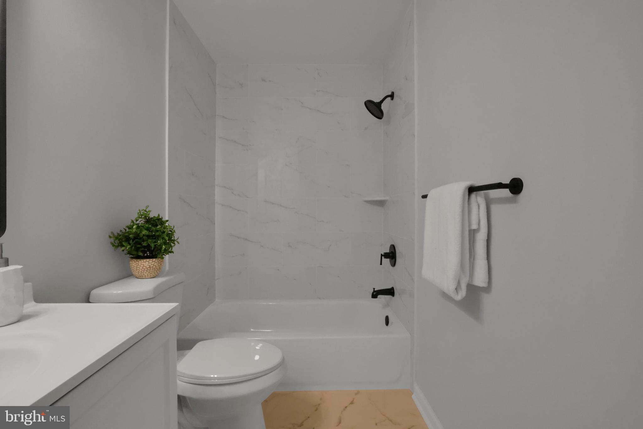 126 Myrtle Avenue Severn, MD 21144 - Photo 33 of 52 a bathroom with a shower a toilet and a sink