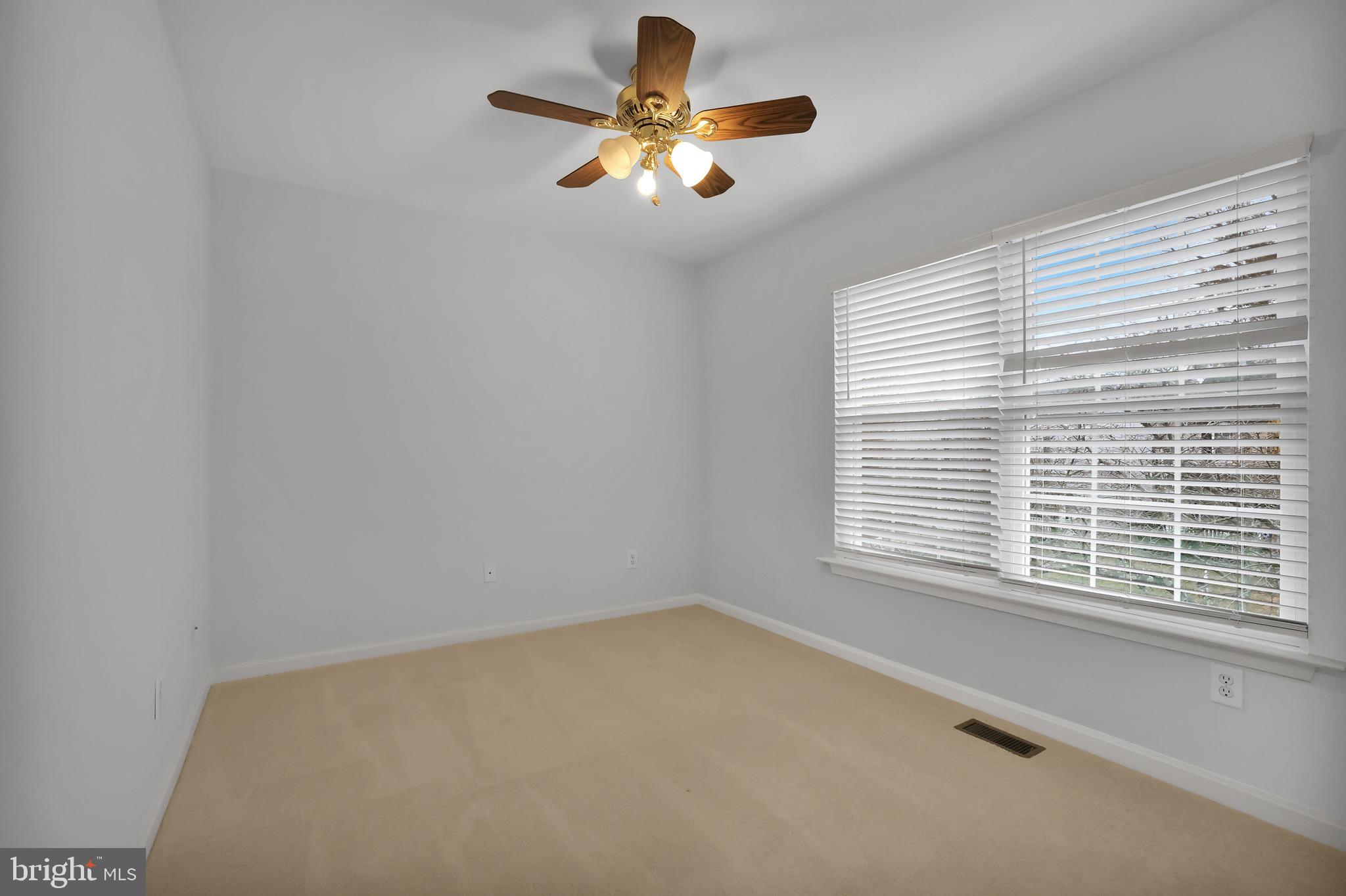 126 Myrtle Avenue Severn, MD 21144 - Photo 36 of 52 a view of a room with a window and a ceiling fan