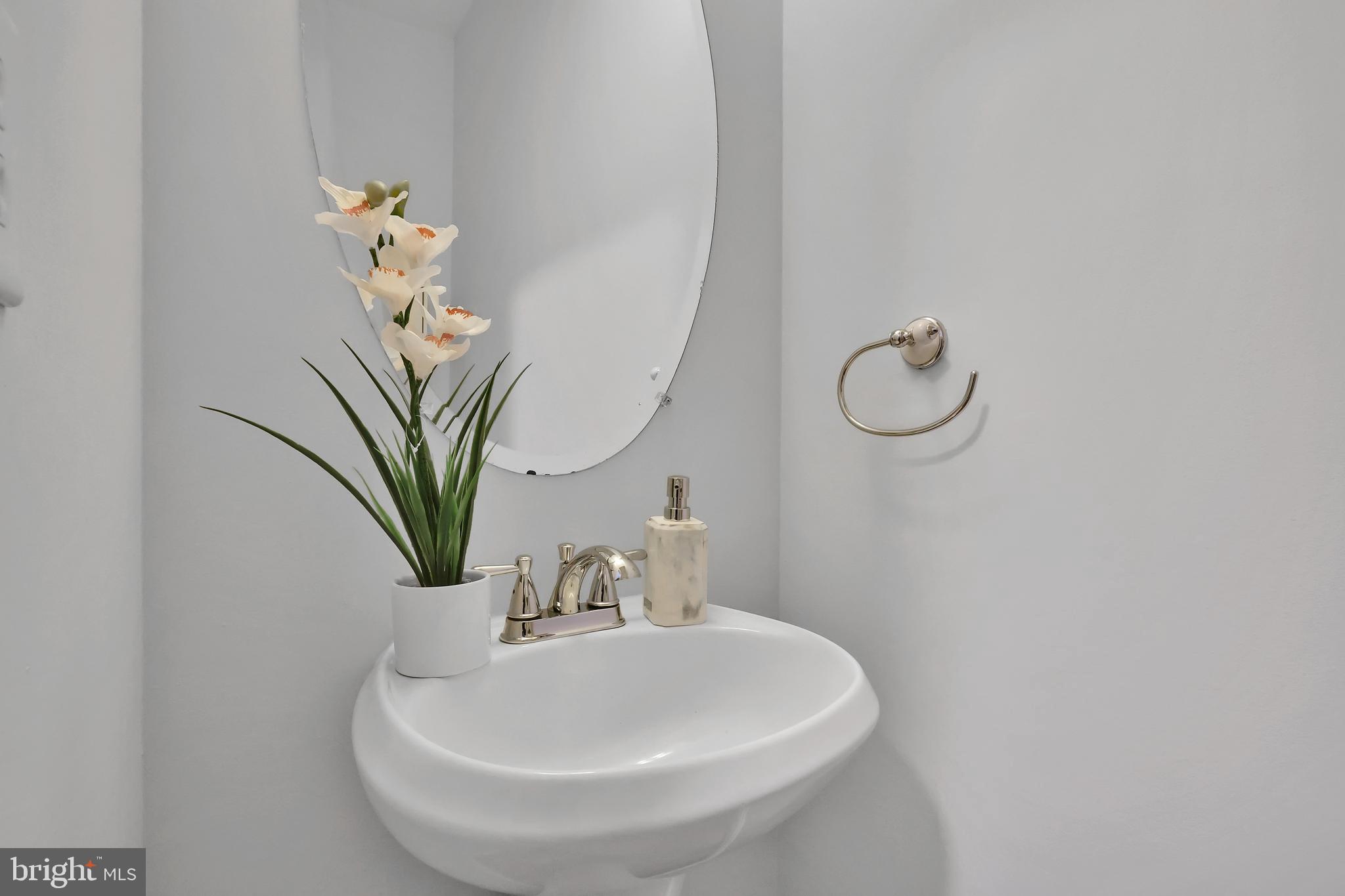 126 Myrtle Avenue Severn, MD 21144 - Photo 40 of 52 a bathroom with a sink and a mirror