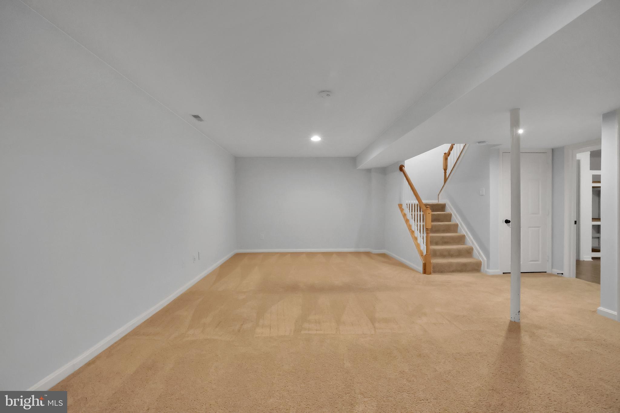 126 Myrtle Avenue Severn, MD 21144 - Photo 42 of 52 an empty room with windows and stairs