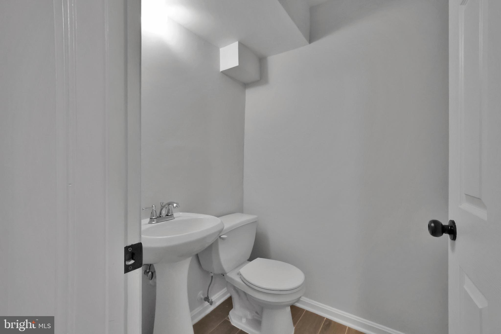 126 Myrtle Avenue Severn, MD 21144 - Photo 47 of 52 a bathroom with a sink toilet and a mirror