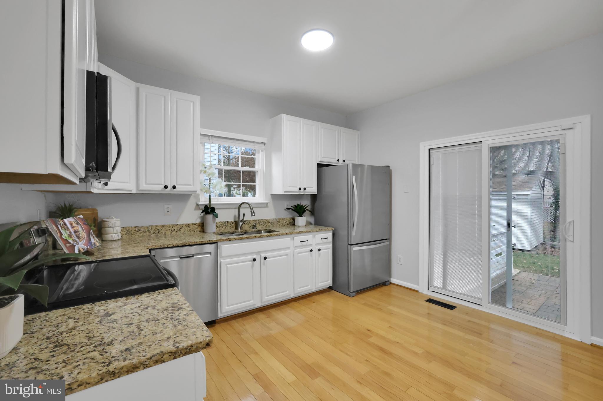 126 Myrtle Avenue Severn, MD 21144 - Photo 8 of 52 a kitchen with stainless steel appliances granite countertop a sink stove and refrigerator