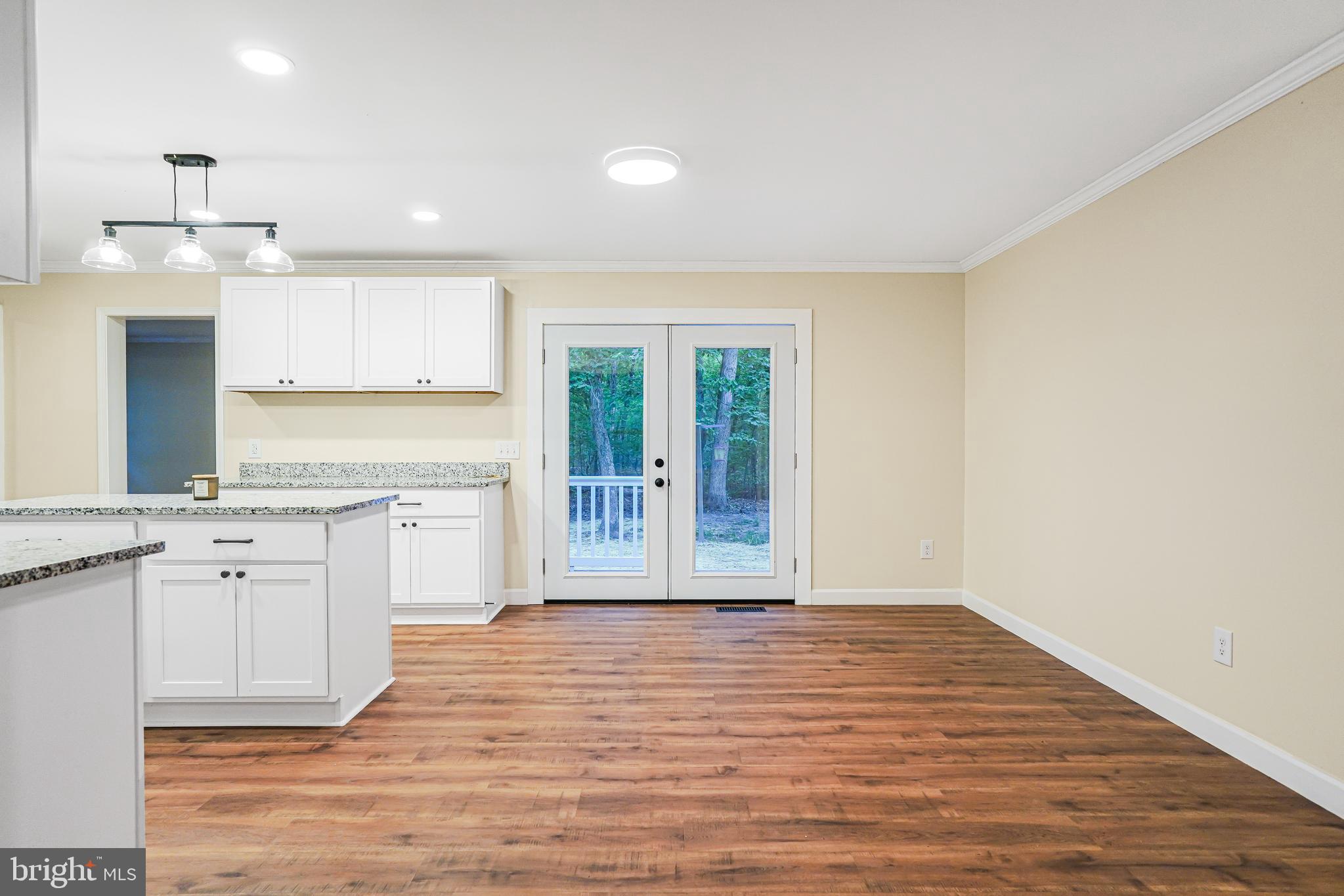 767 Loving Road Zion Crossroads, VA 22942 - Photo 6 of 33 a view of a kitchen with wooden floor and a sink
