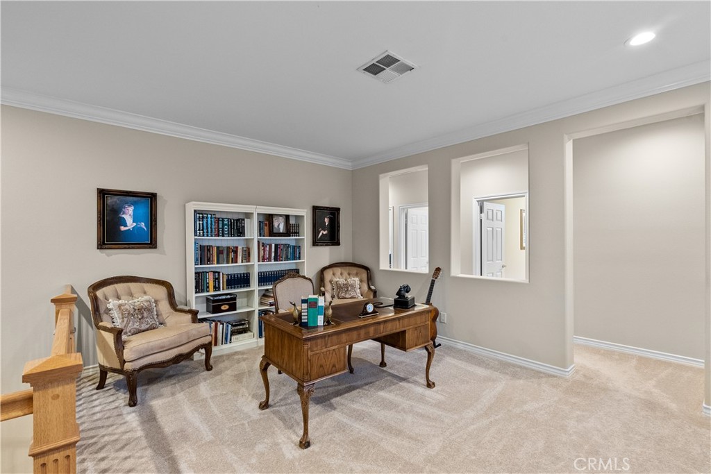 23930 Lakeside Road Valencia, CA 91355 - Photo 32 of 72 a living room with furniture and a potted plant