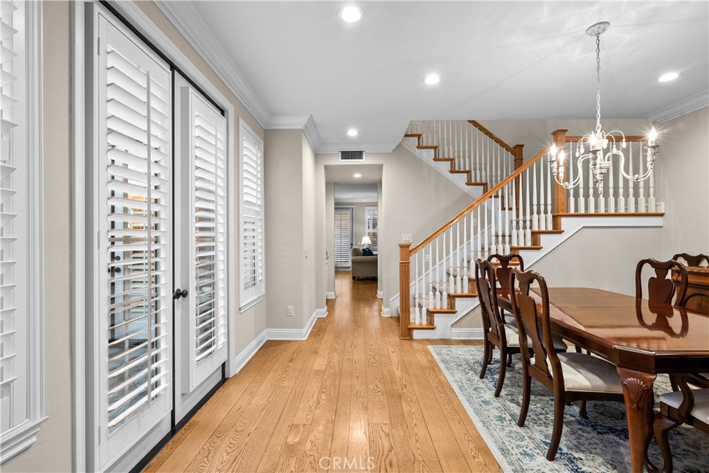 23930 Lakeside Road Valencia, CA 91355 - Photo 10 of 72 a view of a hallway with wooden floor and furniture