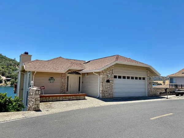 a front view of a house with a garage
