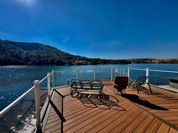 swimming pool view with a lake view