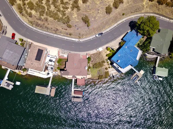 an aerial view of a house with a yard