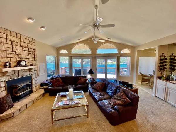 a living room with furniture fireplace and flat screen tv