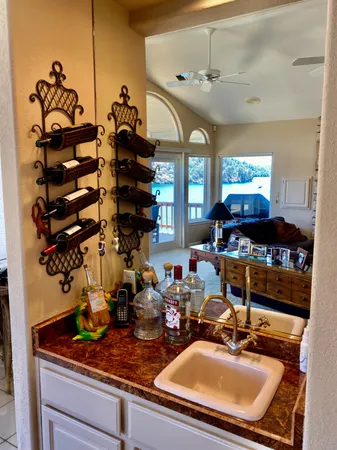 a kitchen with a sink appliances and cabinets
