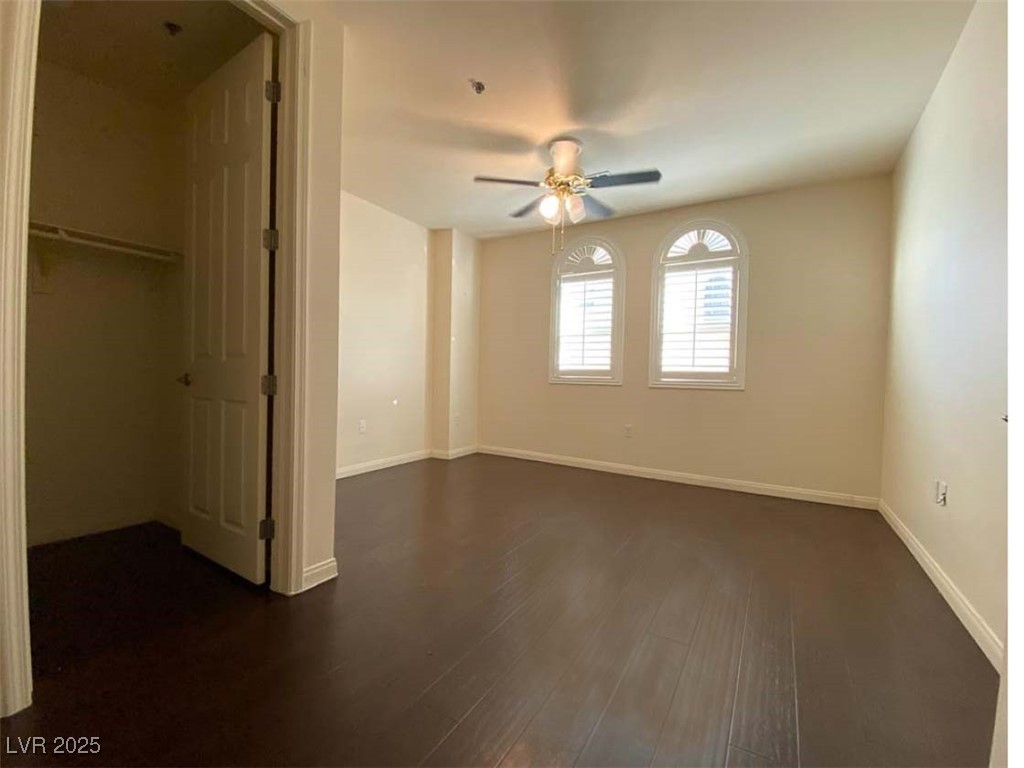 2405 East Serene Avenue, Unit 241 Las Vegas, NV 89123 - Photo 16 of 17 Unfurnished bedroom featuring dark wood-style floo
