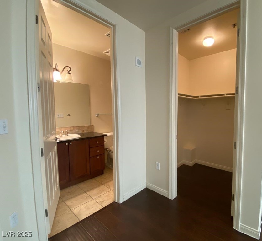 2405 East Serene Avenue, Unit 241 Las Vegas, NV 89123 - Photo 17 of 17 Bathroom in 2nd bedroom featuring vanity, wood fin