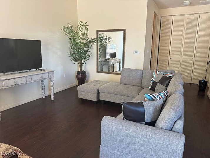 2405 East Serene Avenue, Unit 241 Las Vegas, NV 89123 - Photo 7 of 17 Living room with dark wood-style flooring and base
