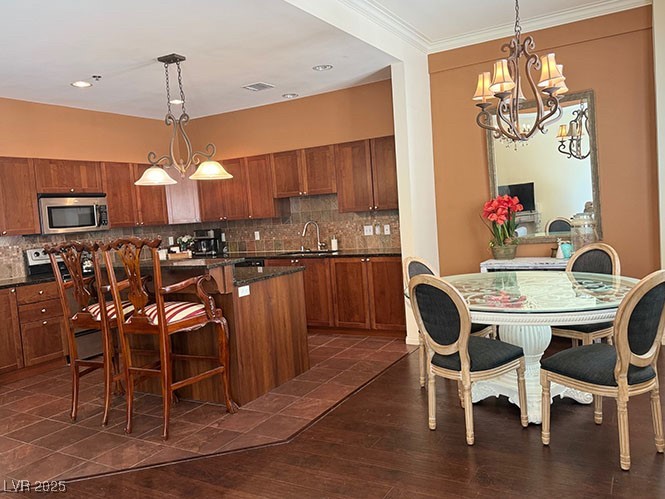 2405 East Serene Avenue, Unit 241 Las Vegas, NV 89123 - Photo 10 of 17 Kitchen featuring stainless steel microwave, brown