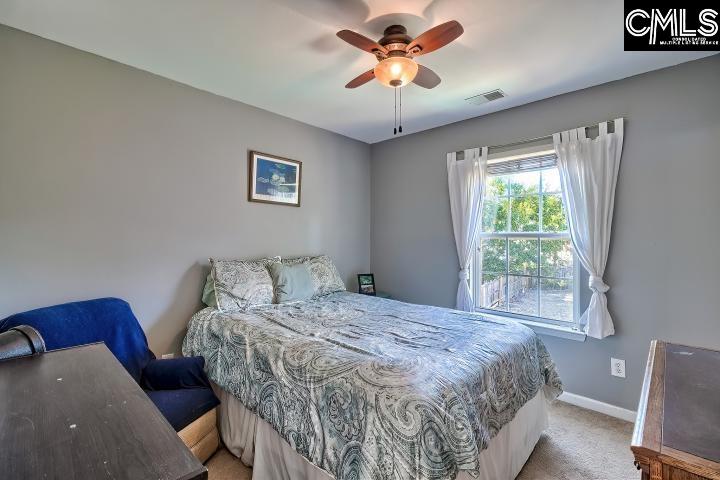 209 Eagle Pointe Drive Chapin, SC 29036 - Photo 23 of 40 a bedroom with a bed and a window