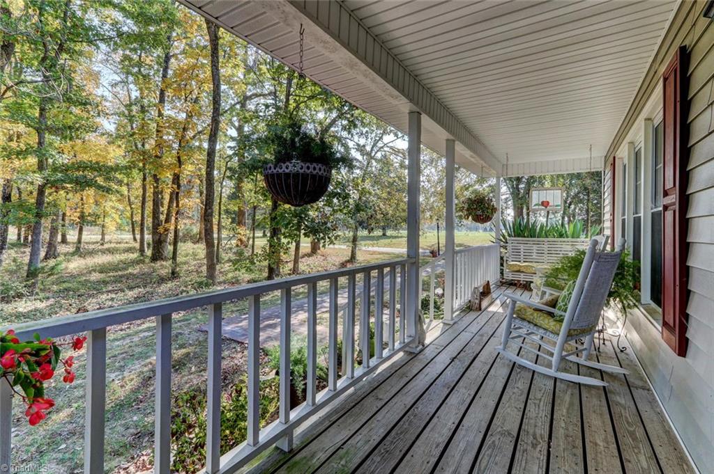 4752 Scythe Road Julian, NC 27283 - Photo 3 of 28 ROCKING CHAIR FRONT PORCH