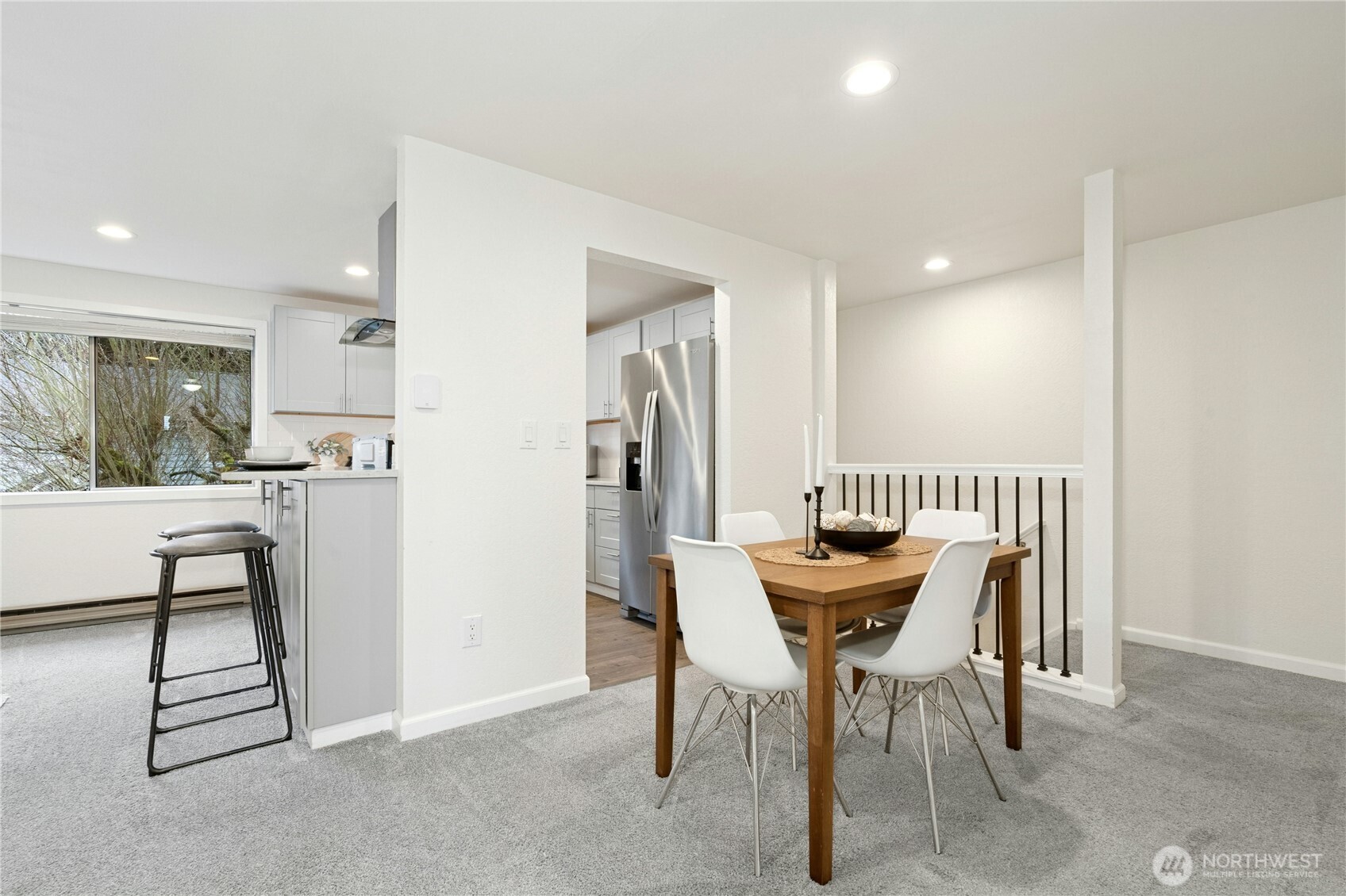 7909 218th Street Southwest, Unit 6 Edmonds, WA 98026 - Photo 11 of 27 a dining room with furniture and a floor to ceiling window