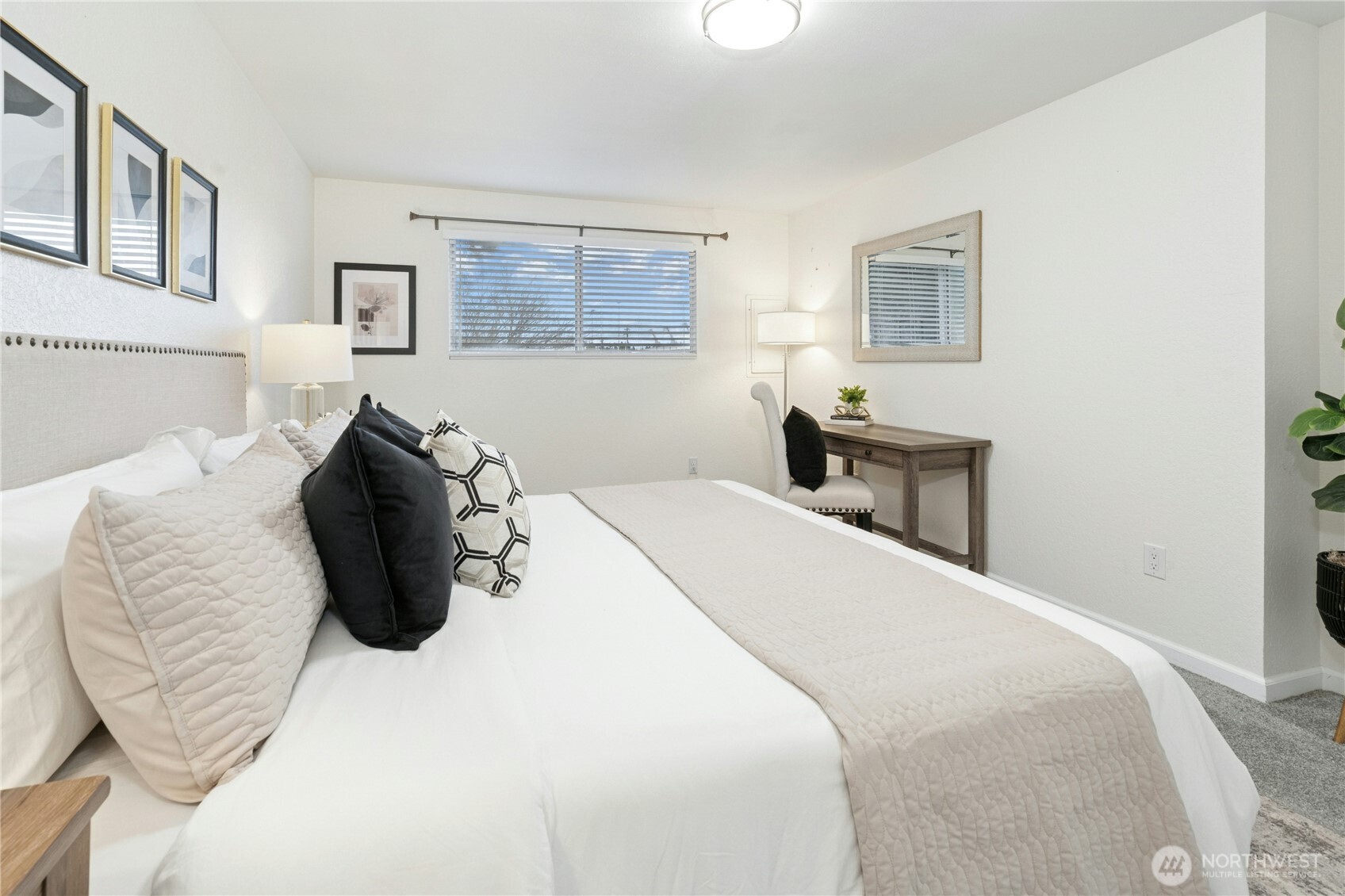 7909 218th Street Southwest, Unit 6 Edmonds, WA 98026 - Photo 12 of 27 a bedroom with a bed and a painting on the wall