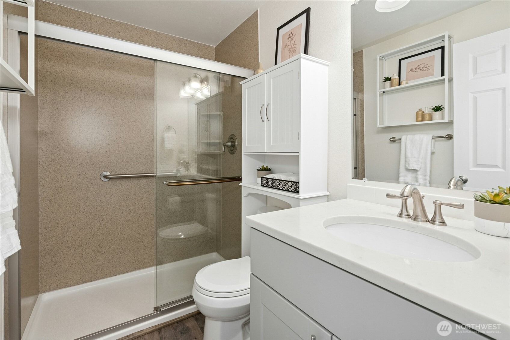 7909 218th Street Southwest, Unit 6 Edmonds, WA 98026 - Photo 14 of 27 a bathroom with a sink a toilet and shower
