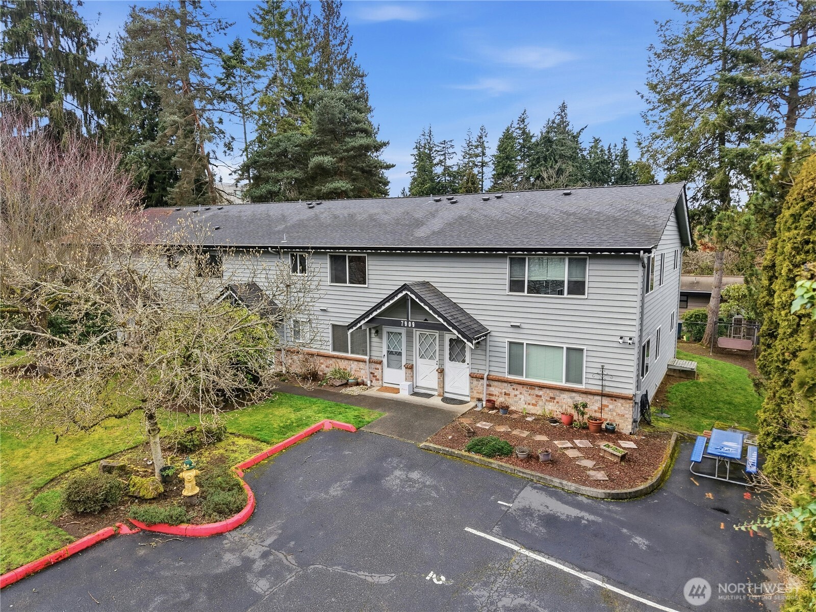 7909 218th Street Southwest, Unit 6 Edmonds, WA 98026 - Photo 26 of 27 front view of a house with a yard