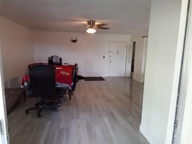 a workspace with furniture and wooden floor