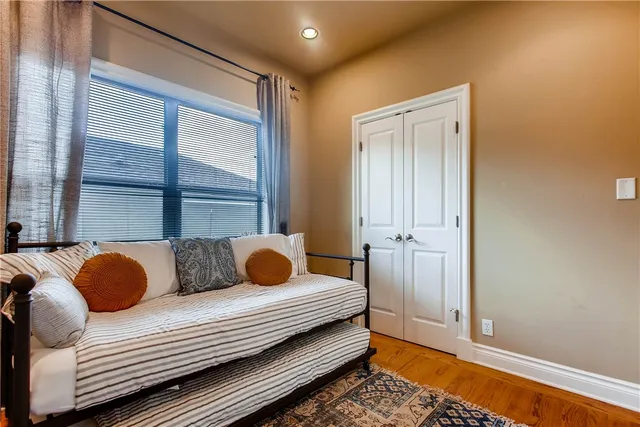 a bedroom with bed and window