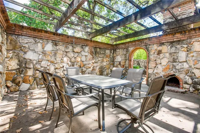 a view of a chairs and table in the patio