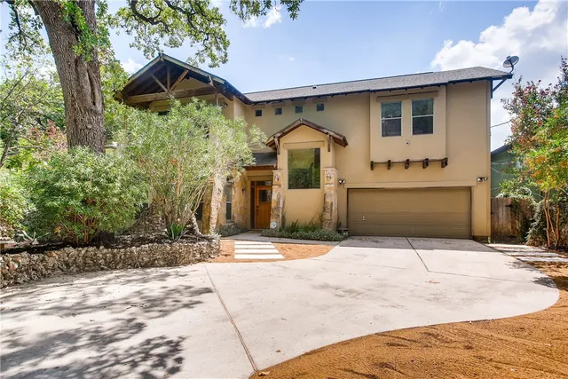 a front view of a house with yard