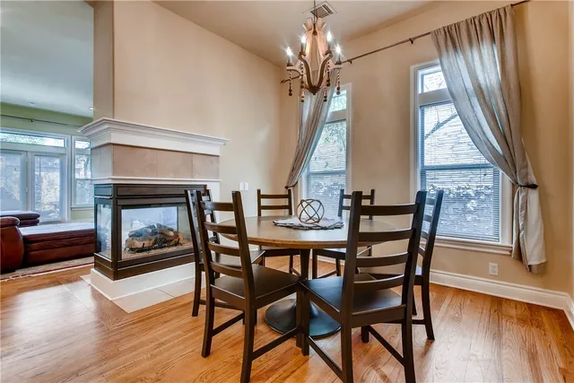 a view of a livingroom with furniture window and wooden floor