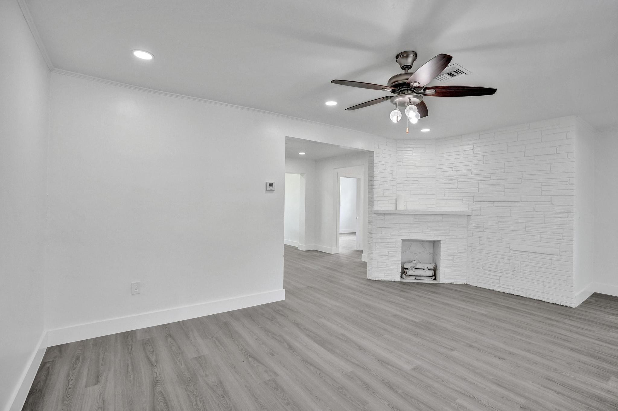 7341 Meridian Street Miramar, FL 33023 - Photo 16 of 74 a view of empty room with wooden floor and fan