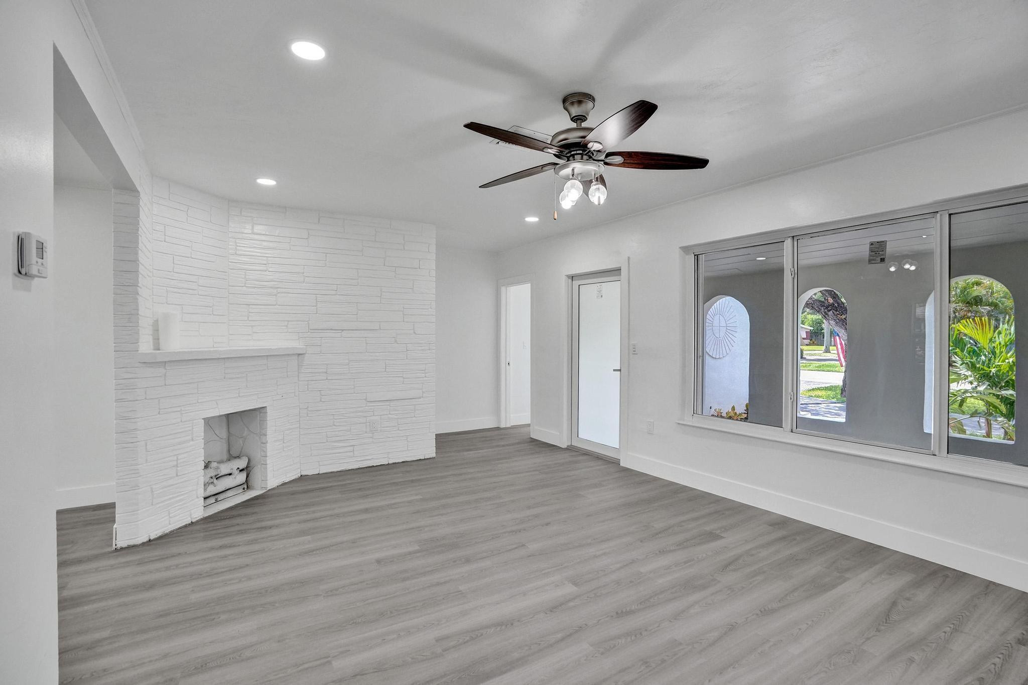 7341 Meridian Street Miramar, FL 33023 - Photo 18 of 74 a view of an empty room with window and wooden floor
