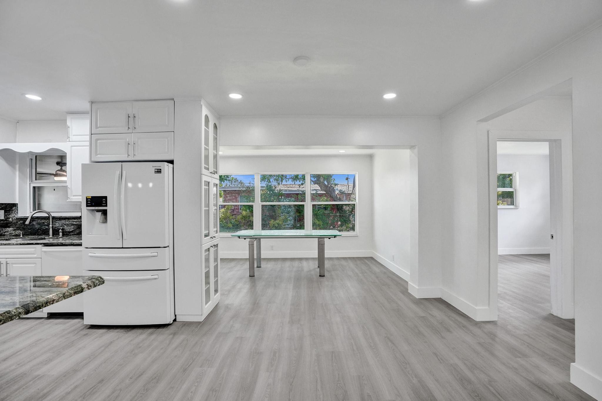 7341 Meridian Street Miramar, FL 33023 - Photo 20 of 74 a view of kitchen with cabinets and wooden floor