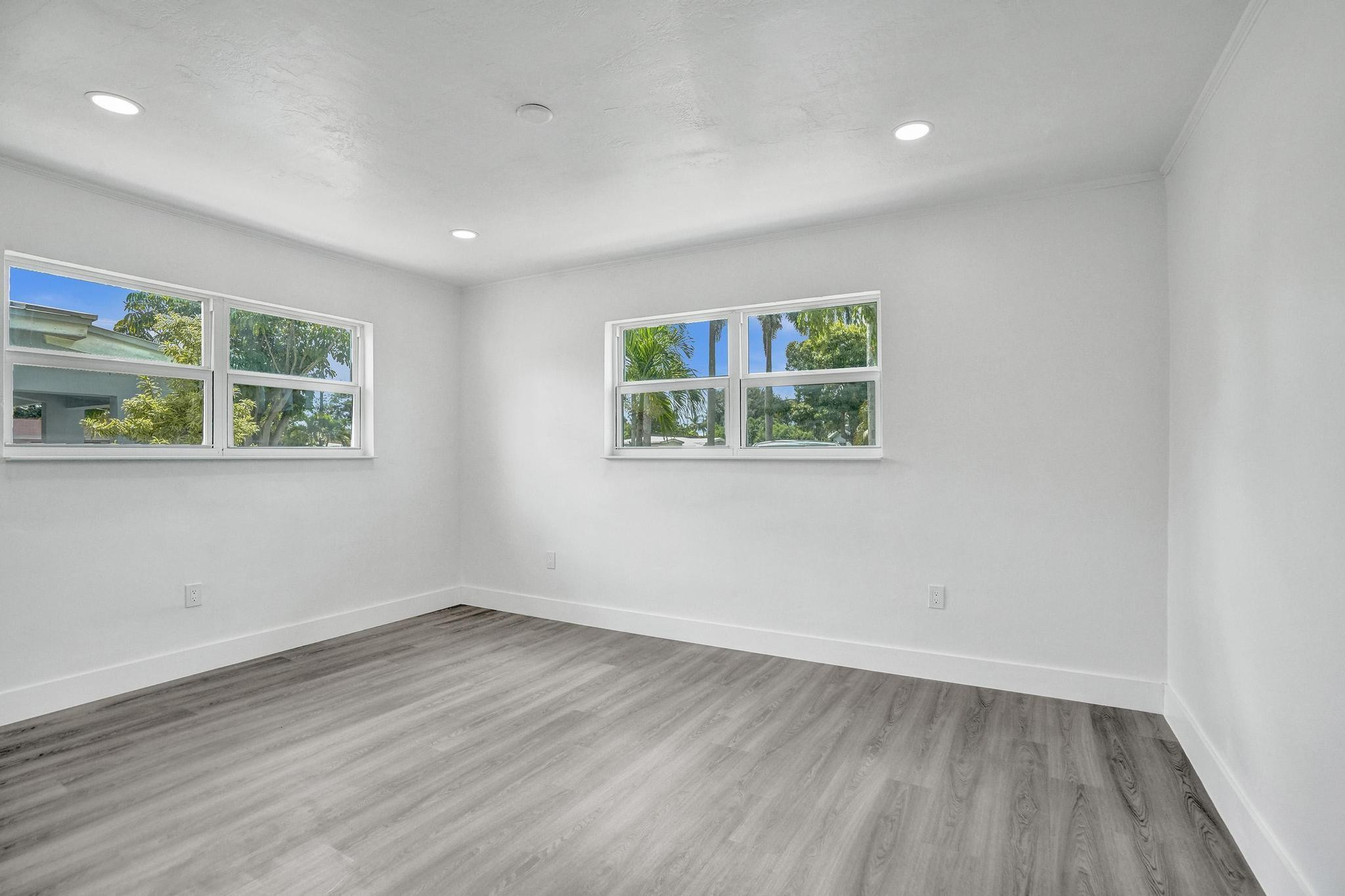 7341 Meridian Street Miramar, FL 33023 - Photo 3 of 74 an empty room with wooden floor and window