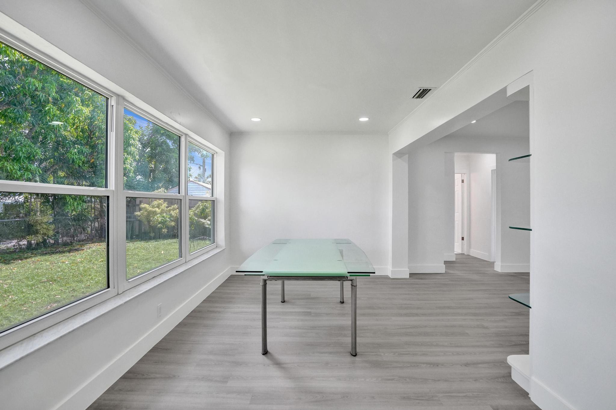 7341 Meridian Street Miramar, FL 33023 - Photo 41 of 74 a view of an empty room with wooden floor and a window