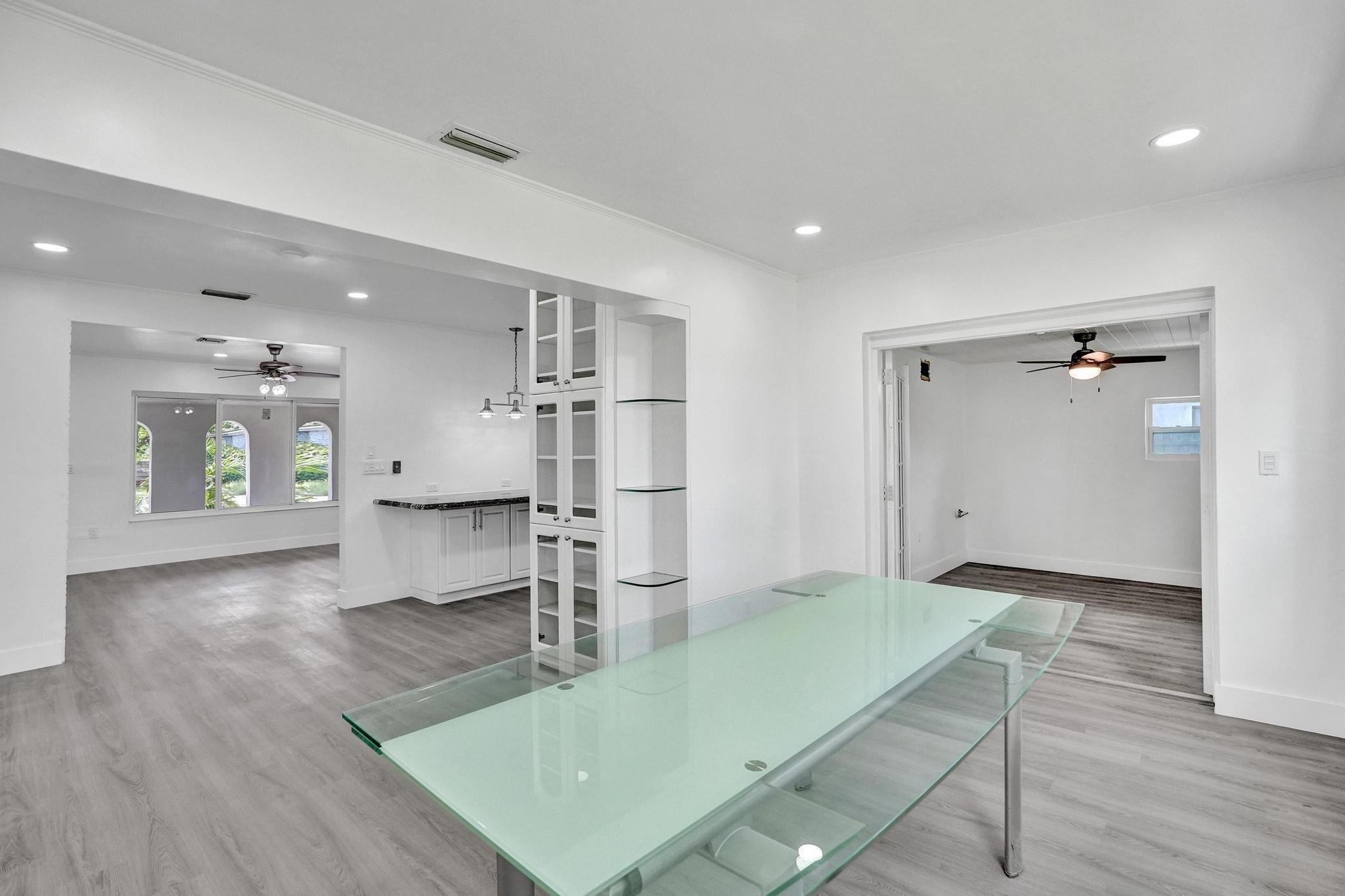 7341 Meridian Street Miramar, FL 33023 - Photo 42 of 74 a living room with kitchen view and a wooden floor
