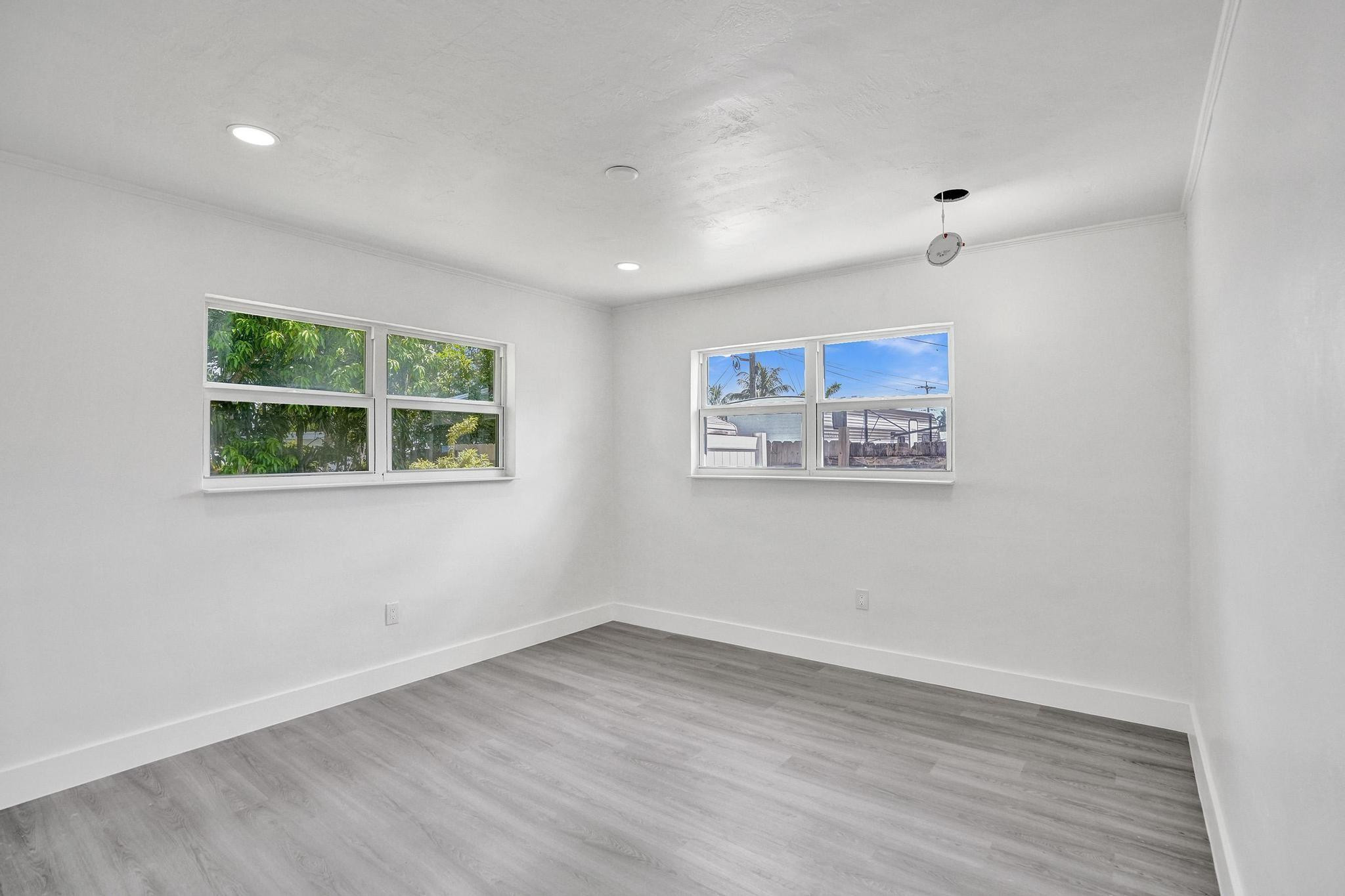 7341 Meridian Street Miramar, FL 33023 - Photo 43 of 74 an empty room with wooden floor and window