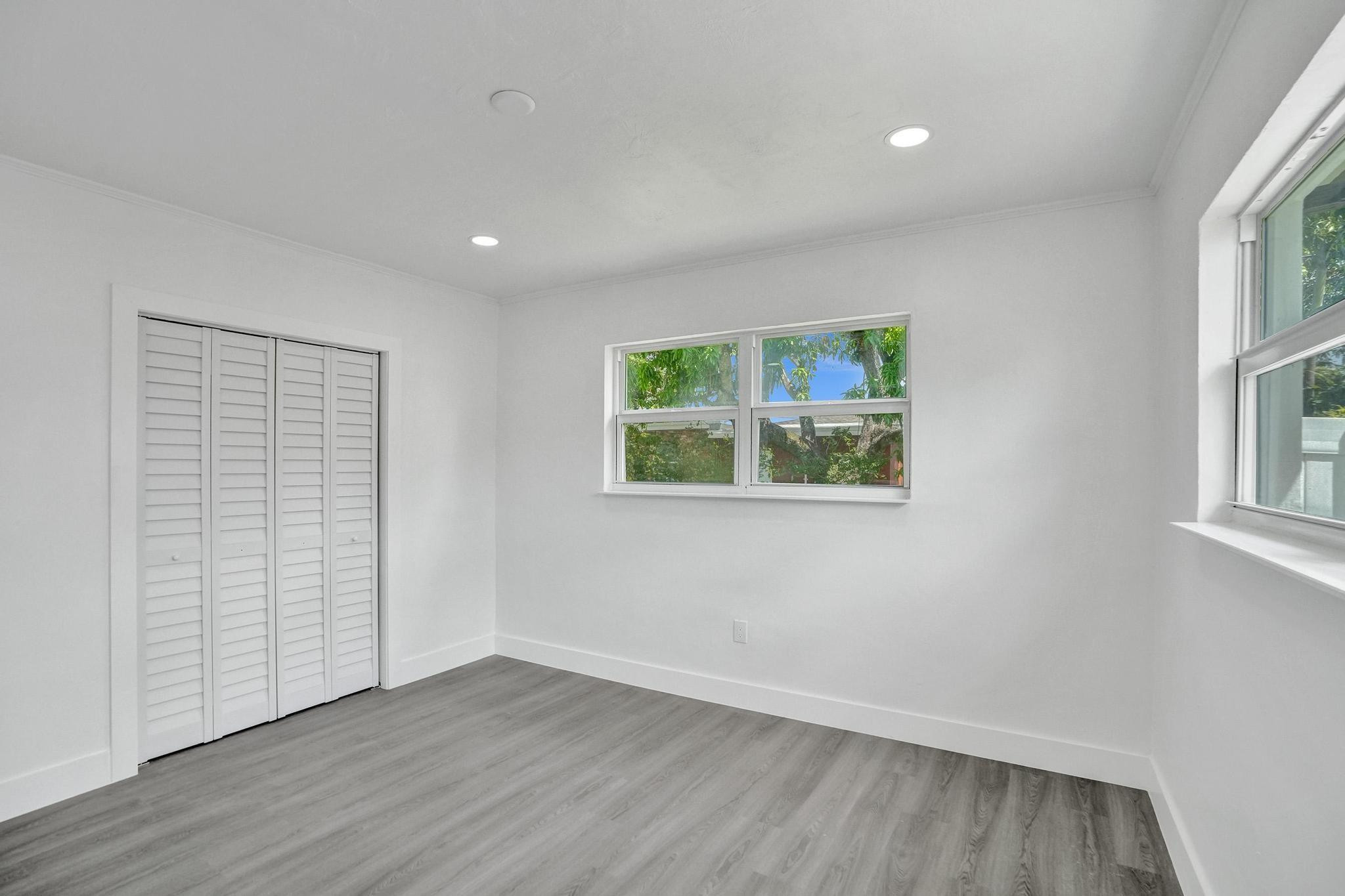 7341 Meridian Street Miramar, FL 33023 - Photo 44 of 74 an empty room with wooden floor and window
