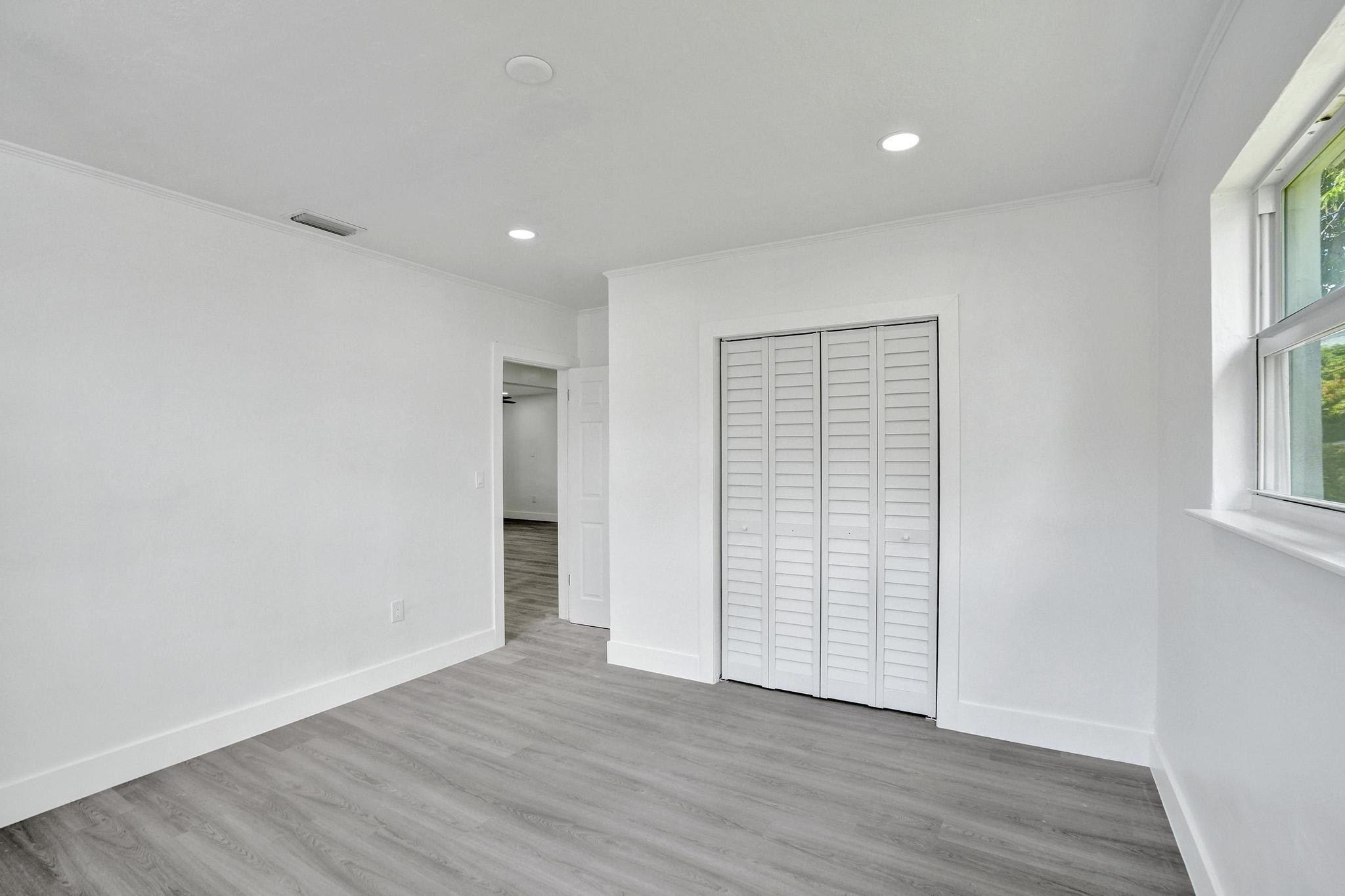 7341 Meridian Street Miramar, FL 33023 - Photo 46 of 74 an empty room with wooden floor & windows
