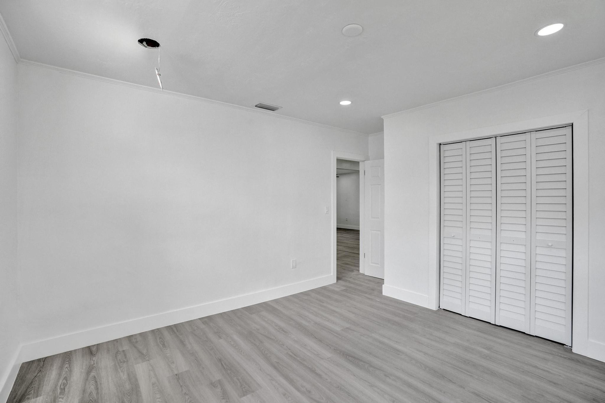 7341 Meridian Street Miramar, FL 33023 - Photo 47 of 74 a view of an empty room with wooden floor