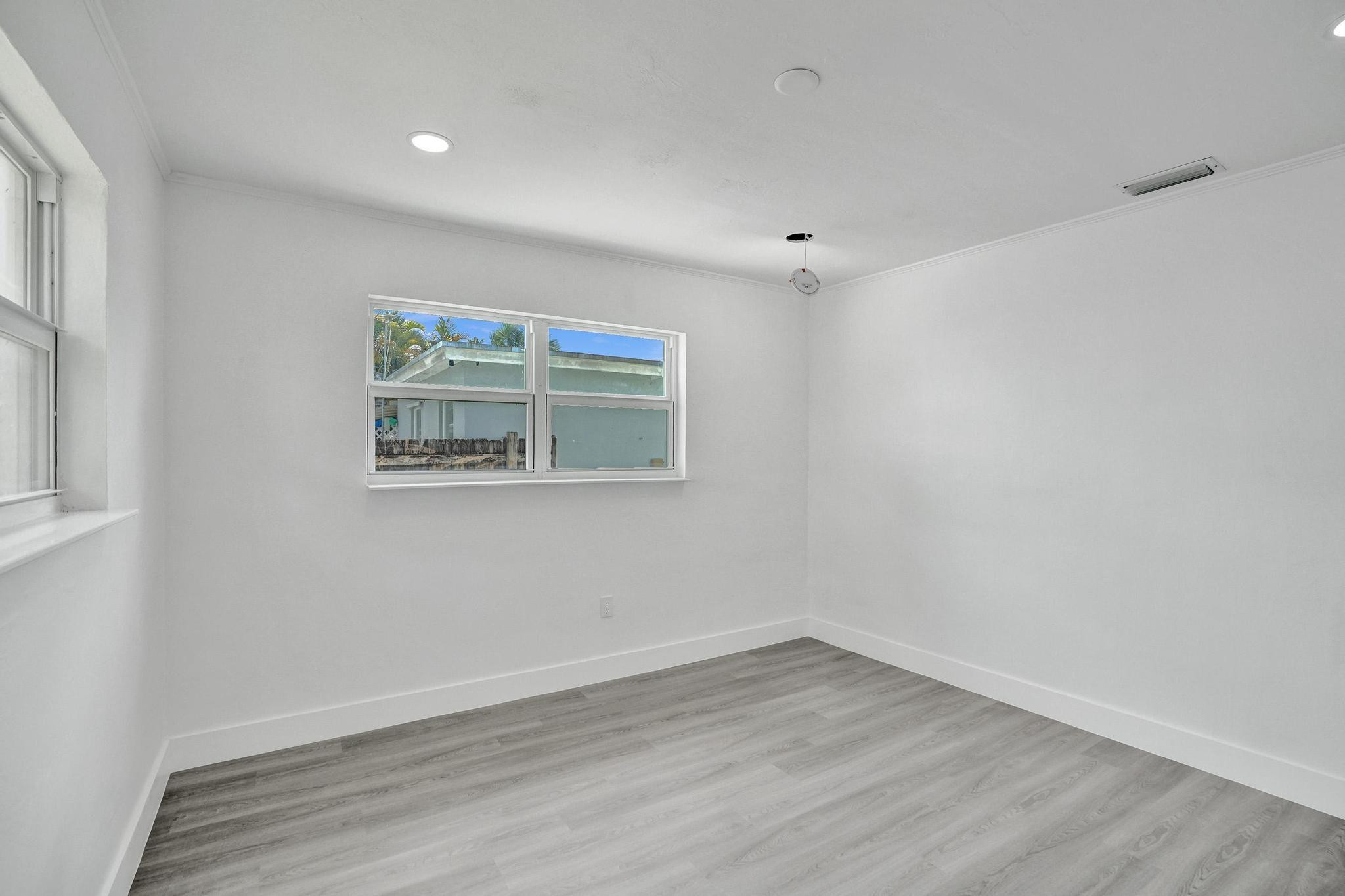 7341 Meridian Street Miramar, FL 33023 - Photo 48 of 74 a view of empty room with wooden floor and fan