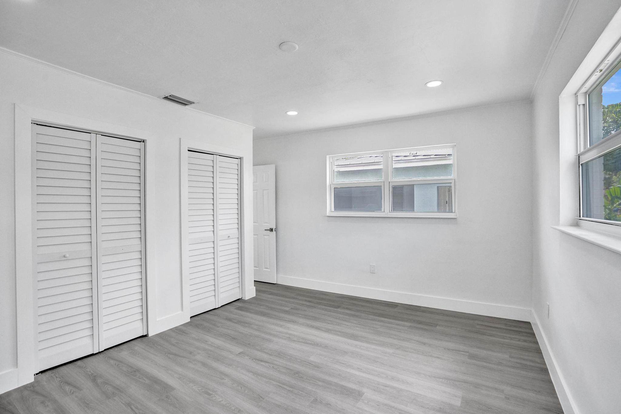 7341 Meridian Street Miramar, FL 33023 - Photo 5 of 74 an empty room with wooden floor and windows