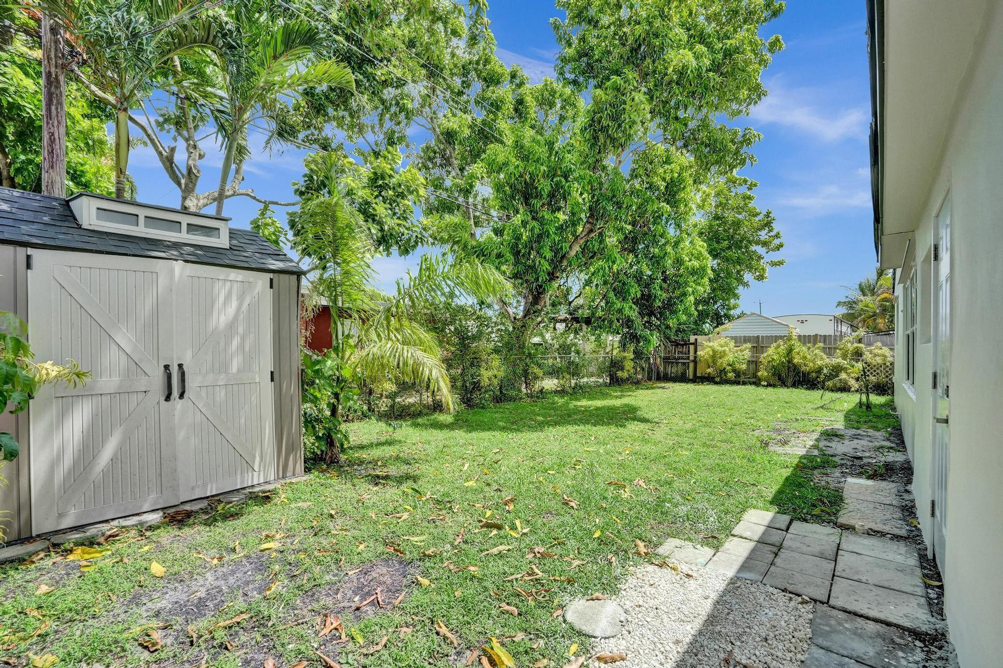 7341 Meridian Street Miramar, FL 33023 - Photo 67 of 74 a view of a back yard of the house