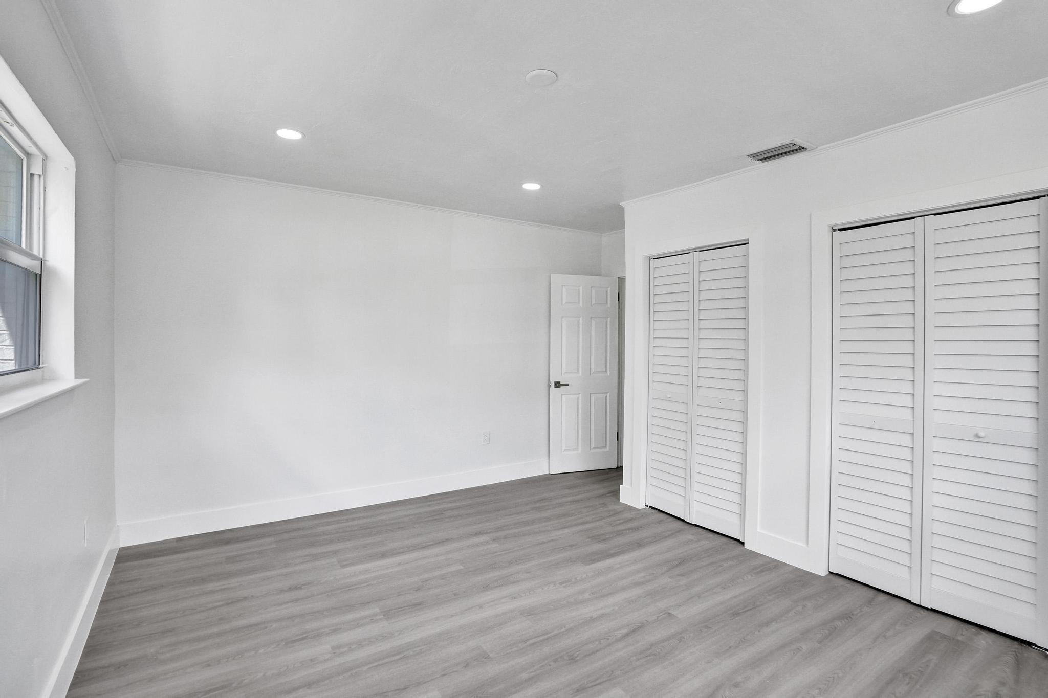 7341 Meridian Street Miramar, FL 33023 - Photo 7 of 74 wooden floor in an empty room with a window