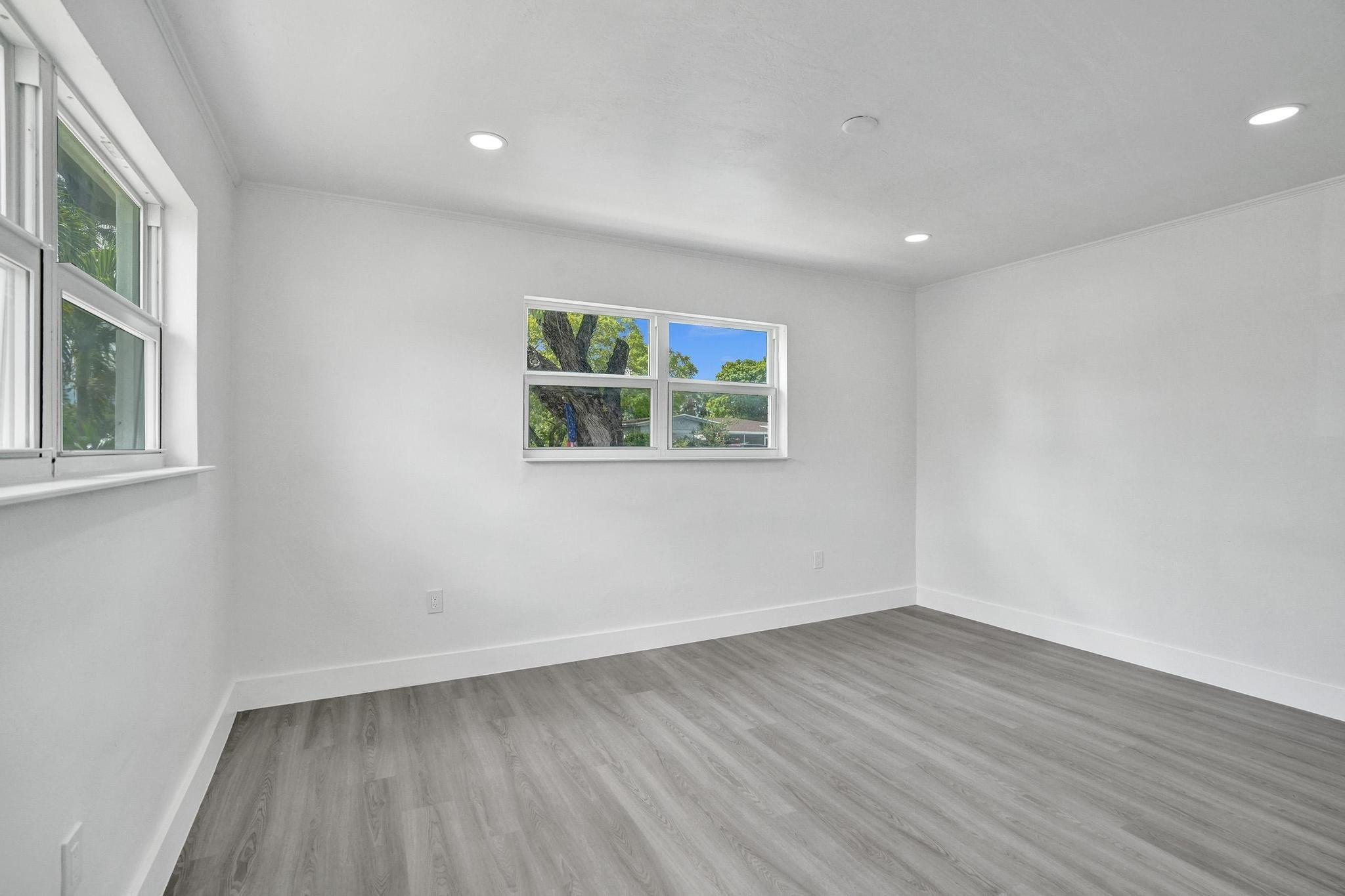 7341 Meridian Street Miramar, FL 33023 - Photo 8 of 74 a view of a room with wooden floor and window
