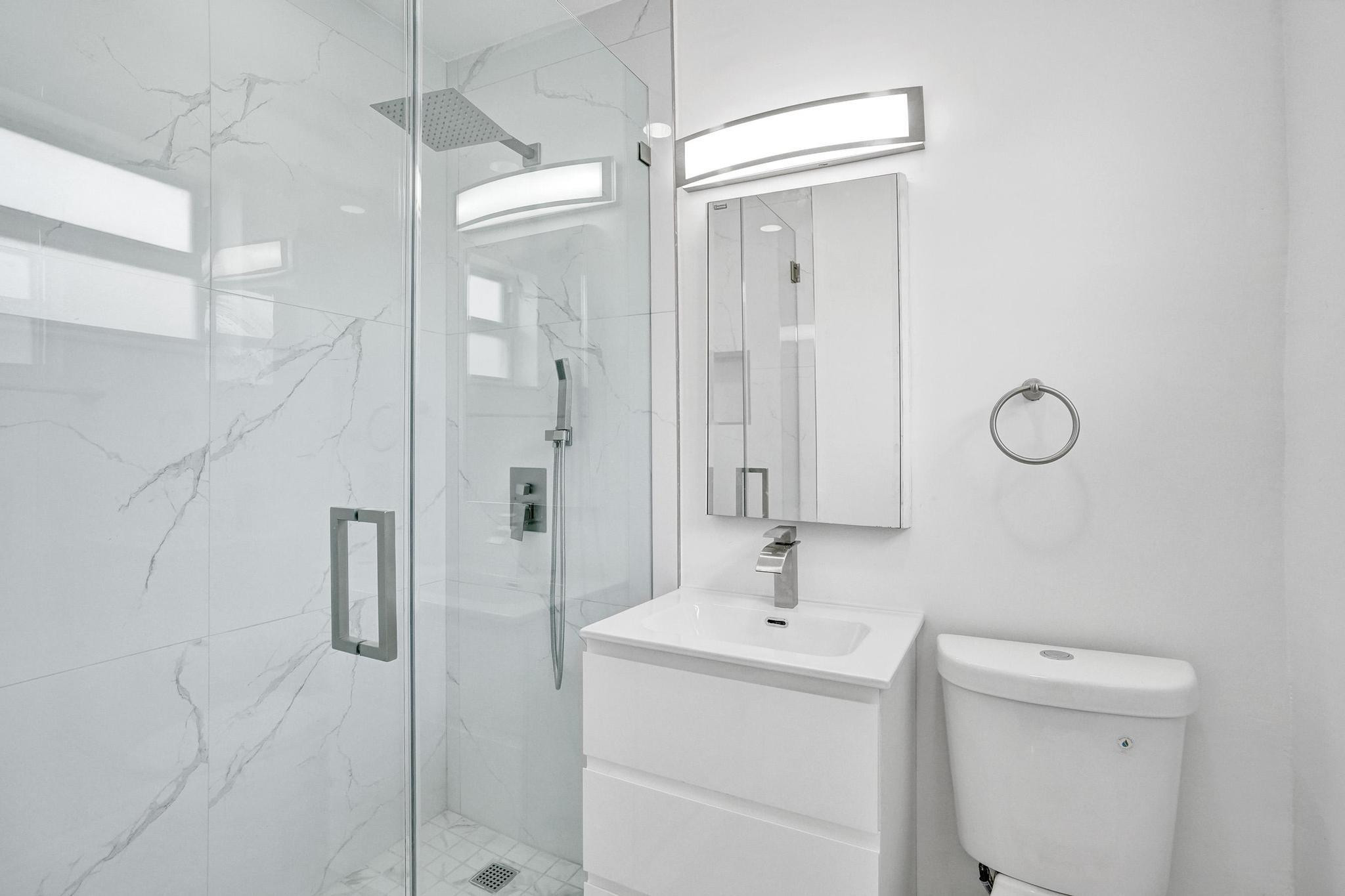 7341 Meridian Street Miramar, FL 33023 - Photo 9 of 74 a bathroom with a sink a toilet and shower